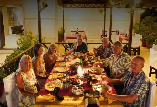 Guests at a long table at Jashan