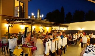 Jashan's terrace at night, full of guests